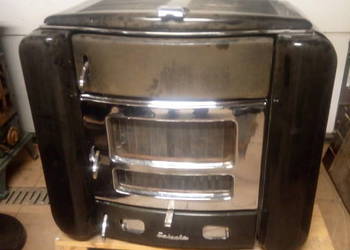 Piec z fajerkami . Kominek zeliwny. 1959. Vintage