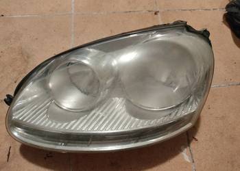 Reflektor VW Jetta III Golf V lewy orginalny hella