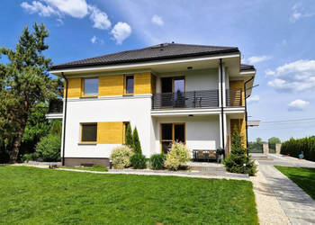 Modernistyczny dom nad jeziorem z funkcją pensjonatu