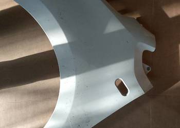 Błotnik skoda city go lewy lekko uszkodzony jak na zdjęciu biały