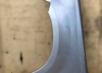 Błotnik lewy przód MITSUBISHI OUTLANDER I do malowania Czarna Opona