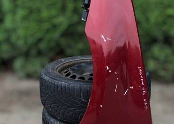 Renault Laguna III 3 błotnik przód lewy kod lakieru nie znany Czarna Opona