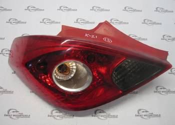 OPEL CORSA D lampa lewa tył 13211840 89038962A