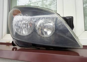 Opel Astra H lampa przednia prawa reflektor przód pasażera 1EG27037002