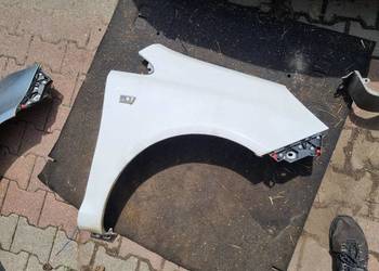 BŁOTNIK PRAWY PRZÓD OPEL CORSA D Z474